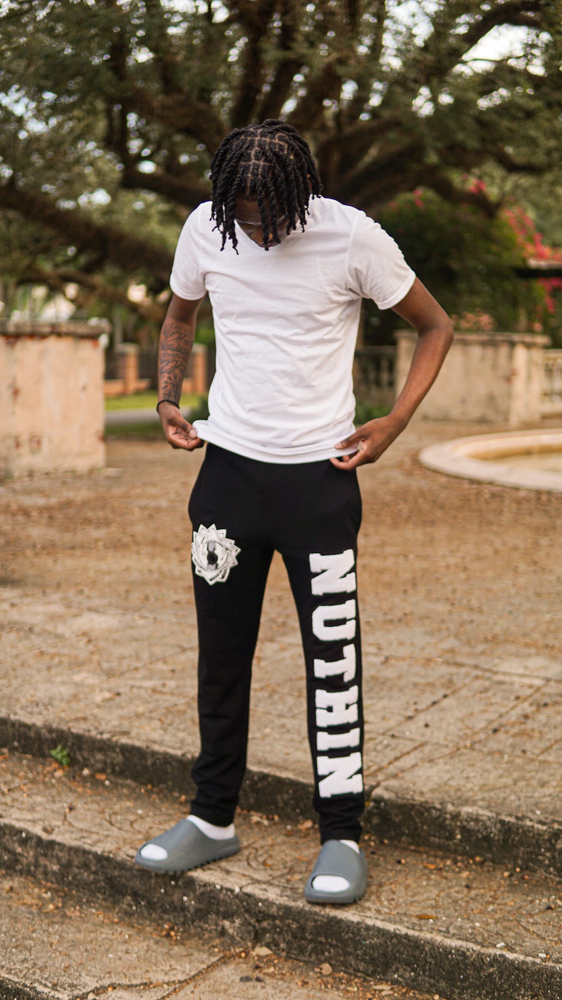"US NEVER THEM" Black Varsity Sweats